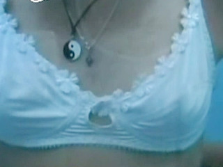 Horny babe in white bra shows her nips and hooters for some XXX Nippen action